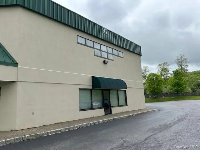 Warehouse - Flex Space - Office and Retail - 1, 700 sq.ft. on lower level with 12 ft. ground level OH door. 20 ft. ceilings and additional office space on second level included in rent but not in overall square feet. Busy Corner location at a traffic light suitable and adaptable for many types of uses. Please call with your requirements.