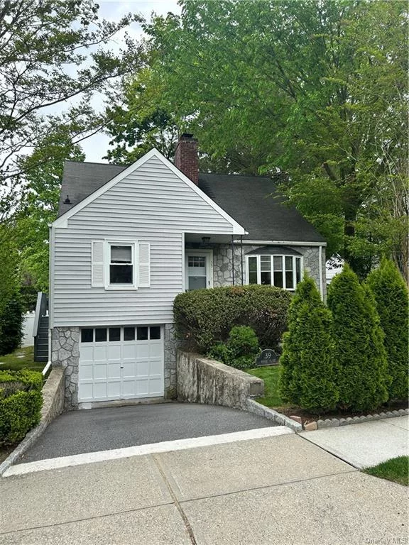 Well maintain nice cape 4BR/2Bth house in great neighborhood. Close to school, park, train, village, shops. Hardwood floors, recessed lights, corian counters, stainless steel appliances, & much more . Two car tandem garage. Metro North Scarsdale train Station is approximately 3 blocks from this home.