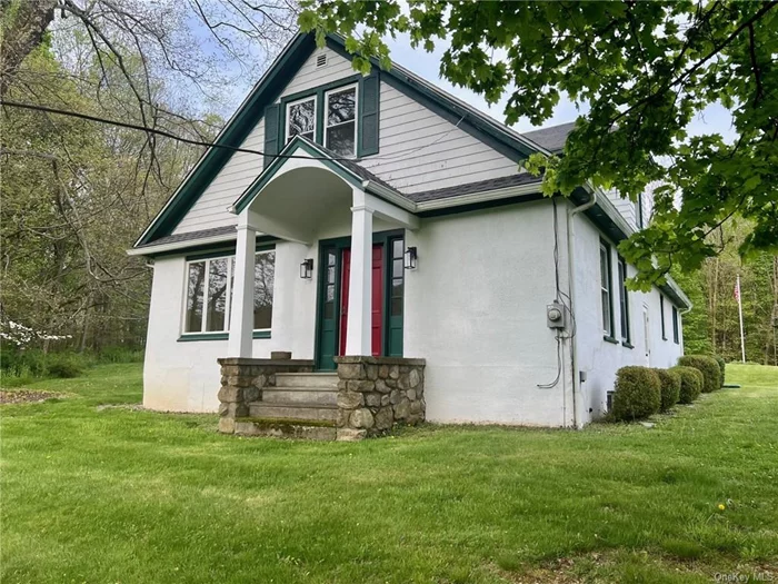 This sweet, circa 1930&rsquo;s home is located in the Village of Millbrook. The charming home provides bright, comfortable living spaces and has been tastefully updated. It sits on a 3/4-acre lot at the top of the Franklin Avenue, the main street of the Village, within walking distance of all that downtown has to offer. With 3 bedrooms, including a first-floor bedroom, two full baths, living room with fireplace, eat-in-kitchen, formal dining room, and lovely sunroom, this house is sure to please. Outside, an enjoyable patio with retractable awning is perfect for dining al fresco or just relaxing. A detached, two car garage is included, and a full basement provides plenty of storage.