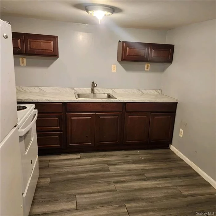 Recently renovated 1 bed 1 bath apartment with updated kitchen and bathroom. The apartment has brand new tile flooring, sheetrock, insulation, and paint. The unit features a private entrance and parking for 2 vehicles. Walking distance to Main St. shopping and NYC bus stop. Tenant pays heat and electric. Showings will start June 1. Please do not stop by the building and bother current tenants. All questions call broker. Thank you.