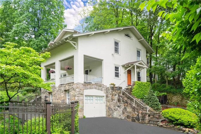 Welcome to a charming 1920s gem in Hastings-on-Hudson. This inviting, four-bedroom, three-and-a-half bath home is nestled on a picturesque, large wooded property featuring beautiful stone walls lining an active streambed. The newly fenced property contains natural rock outcroppings with expanded bluestone terraces, restored and upgraded gravel paths with gardens fed by an automatic irrigation system. Imagine hosting gatherings filled with laughter and lively conversations on the cozy covered porch and elegant terrace. Recent updates include a new roof, insulated walls and roofs, new exterior paint, new heat pump HVAC, washer/dryer and hot water heater, The interior has been renovated with new wood and LVT floors, powder room, primary bathroom, while maintaining the original charm of the Craftsman Style architecture. It also features a natural gas fired generator for peace of mind. The chef&rsquo;s kitchen boasts stainless steel appliances new heat pump HVAC , a new gas range and microwave and generous cabinet and counter space. The property has ample parking for 4 cars and an attached garage for 1 car. Located in the desirable Riverview Manor, this home is just a 10-minute walk to everything Hastings has to offer: Metro North train station, all schools, shops and restaurants, a community pool and tennis courts, and the weekly farmers&rsquo; market. Experience the warm, easygoing vibe that makes Hastings so desirable!