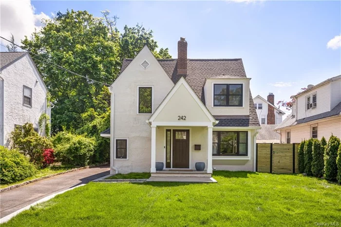 Gut renovated Modern Tudor in the heart of Edgewood! This charmer is set in the most convenient locale, within walking distance to Edgewood Elementary, Scarsdale High School, shops, Metro-North, and just a one-minute walk to Davis Park, Bee-line bus. This lovely sunlight flooded home boasts a perfect layout, featuring an open plan kitchen/dining/family room with sliding glass door walking out to the patio and backyard, a formal living room, office, powder room, guest closets and covered front porch. Upstairs, the second level boasts a south-facing primary suite with a large bedroom, huge walk-in closet, double vanity, two additional spacious bedrooms and a full bath, while downstairs, the finished lower level is great for entertainment and contains a laundry, huge storage, and room for potential guest suites. A beautifully finished two story garage is an opportunity for a gym, additional office, or extra storage space.The sunny, lush fenced level backyard is great for recreation and outdoor activities. Move right in!