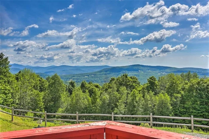 Back on the Market! 90 Miles from NYC!! This magnificent top-of-the-mountain Oasis is waiting for you! At the end of a dead end street, you&rsquo;ll continue ascending up almost 2000 ft. following a long winding, lighted, paved driveway. When you arrive at the top, you&rsquo;ll be overlooking the Neversink Valley and Catskill Mtns. with Amazing Views! this mini estate boasts 14 acres, multiple out buildings and an Impressive 3100 sq. ft. Main House with an interior made of 90% Pure Cedar. This property has everything! Just to mention some of the unique features, you&rsquo;ll enjoy an almost perfect infinity Inground Pool with Large Gazebo, Chef&rsquo;s Gourmet Kitchen, Solarium with Hot Tub, Koi Pond, 3 car att. heated garage with dumbwaiter that connects to the kitchen, 3 blue stone wood-burning fireplaces, Central A/C, Back-Up Generator, High Speed Internet and Cable TV, a Large Media Room/Den, ALL with Fantastic views from its 200 feet of wrap-around decking. The Master Suite is engineered for privacy. It has its own fireplace, huge walk-in closet, a steam shower and 3 large double doors facing due east...which is sited as one of the best views in Sullivan County. On the lower level, there is an additional master suite with ensuite bath plus 2 more main level secondary bedrooms. If you need more space, check out the 3 additional outbuildings that includes a detached garage.