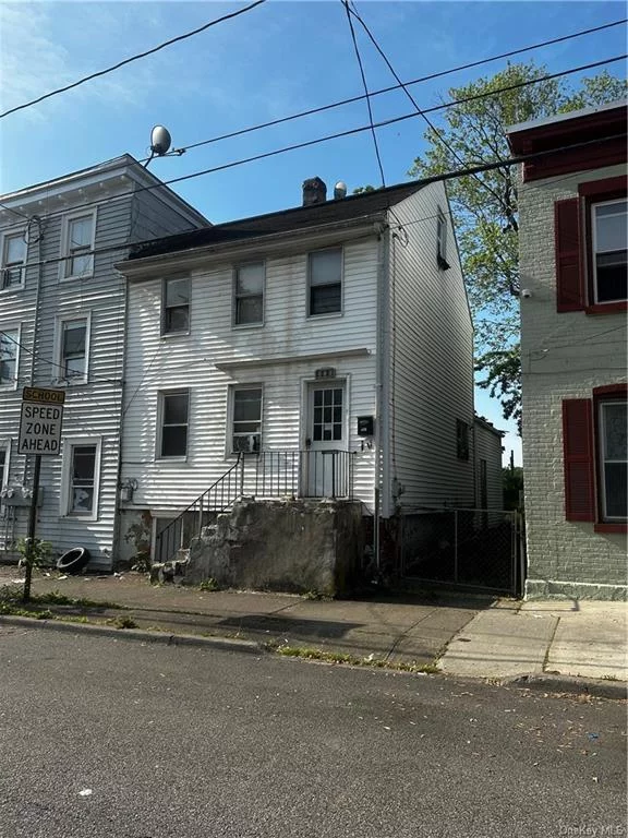 Located within historic Newburgh, this home is within walking distance to restaurants, the fabulous waterfront and ferry to train station. This 3 bedroom 2 bath town home needs a little TCL to make it shine like new again. Driveway is gated to the right of the home.