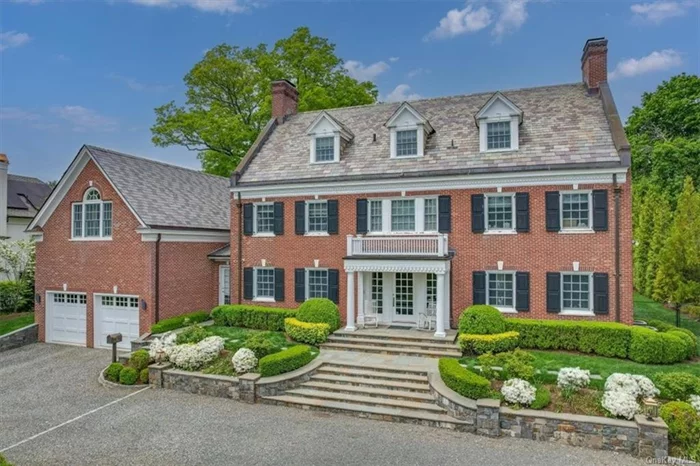 Elegant and extremely rare COMPLETELY RENOVATED all-brick Colonial perfectly located on one of the most beautiful and sought-after streets in Scarsdale. This exceptional and admired residence seamlessly blends prized classic architecture with modernity and exemplifies sophistication, character and timeless elegance. A stately setting with a circular drive surrounded by meticulously landscaped grounds and wide stone steps to the front terrace exudes a sense of arrival to the well-appointed residence showcasing impressive old-world grandeur updated with today&rsquo;s modern amenities. Completely renovated in 2013/2014 and spanning 7, 662 square feet, this home presents a truly unique opportunity. A beautiful setting on over 1/2 acre level and private backyard, this residence is complete with a gorgeous pool with spa surrounded by a limestone patio. The stately formal entrance hall welcomes guests with its impressive proportion and grand wrap-around staircase detailed with a windowed landing that spans all three floors. The stunning entrance hall sets the tone for the exquisite formal and informal interior spaces that follow. The main level offers grand living spaces designed for elegant entertaining and casual everyday enjoyment. Oversized windows provide generous sunlight and picturesque views of the lush grounds, sparkling swimming pool, and patios. The center hall layout features an expansive formal living room with a fireplace that opens to a glass-enclosed room (currently used as a dining room) with views and doors to the property. A formal dining room (currently used as a family room) features coffered ceilings and a beautiful fireplace. This grand space features a versatile setting for stylish living. The heart of the residence is the spectacular eat-in chef&rsquo;s kitchen appointed with top-of-the-line appliances, all-white cabinetry, and an oversized center island all with white marble countertops. The kitchen features a generous separate breakfast area and a built-in desk and is open to an airy sun-filled family room/playroom surrounded by windows and glass doors to the pool and property. Conveniently located off the kitchen is a mudroom with custom built-ins, a side door, and direct access to the attached two-car garage. Two elegant powder rooms, one formal and one informal, complete the first level. On the second level, there are four spacious ensuite bedrooms, including the breathtaking primary suite. The luxurious primary bedroom with vaulted high ceilings, features a large separate sitting room with a fireplace and a large dressing area that opens to two oversized custom-fitted walk-in closets. The primary closet is a fashionista&rsquo;s dream come true offering floor-to-ceiling storage, a center island and a balcony. The dressing area also opens to the modern, spa-style white marble primary bathroom with high ceilings, a standalone soaking tub, a glass-enclosed shower, and two separate vanities.  The third level offers a large bedroom, an expansive recreation room, a fully renovated bathroom and a spacious laundry room. The walk-out lower level features a state-of-the-art temperature-controlled wine cellar and a gym (both of which are included in the total square footage). The lower level also features ample storage space and pre-designed spaces allocated for a bedroom with plumbing for a full bathroom that can be fully finished. With its impeccable craftsmanship, traditional design, and updated interiors, this breathtaking Scarsdale residence offers a rare opportunity to move right in and enjoy unparalleled luxurious living within 35 minutes of Midtown, Manhattan!