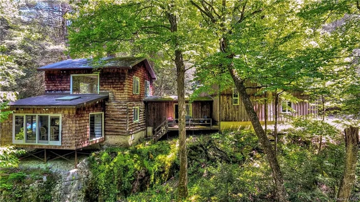 Escape to your own private retreat with this enchanting cabin, nestled on 87.7 acres of picturesque land, most of which is enrolled in the 480A forestry program. This unique property boasts an unusual floor plan that perfectly complements its natural surroundings, making it a haven for nature lovers, artists, and outdoor enthusiasts alike.  As you enter the cabin, you&rsquo;ll be captivated by the expansive sunroom, which offers breathtaking views of the river and dam. This serene space is perfect for enjoying your morning coffee, reading a good book in the afternoon, or simply soaking in the natural beauty that surrounds you. The home offers 2, 648 square feet of living space, which provides ample room for comfortable living and entertaining.  One of the highlights of this property is the spiral staircase leading to a former photography studio, complete with a separate dark room with a full bath. This versatile area can be transformed to suit your needs, whether it be an art studio, home office, guest suite, or hobby room. The home also features a total of two full bathrooms, ensuring convenience for both family and guests.  The majority of the 87.7-acre property is part of the 480A forestry program, offering both serenity and potential tax benefits through sustainable land management. This tranquil, wooded environment is perfect for those seeking a peaceful year-round residence or a seasonal getaway.  Area amenities within 30 minutes include Bethel Center for the Arts, Resorts World Catskill Casino, Kartrite Water Park, Monticello Harness Racing, and excellent dining. Find skiing, fishing, yoga, and hiking nearby. 90 minutes from NYC.  This cabin offers a rare opportunity to own a substantial piece of land with endless possibilities. Experience the best of both worlds  seclusion and convenience  in a truly unique setting. Don&rsquo;t miss out on making this nature lover&rsquo;s dream your reality. Contact us today to schedule a private showing.