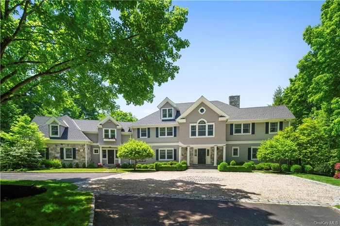 This exquisite Armonk residence offers unmatched privacy amidst landscaped grounds, showcasing a saltwater pool complemented by a stylish pergola, stone terraces, and vast lawns within the esteemed Thomas Wright neighborhood. Its timeless colonial architecture blends seamlessly with the meticulously maintained interiors. The heart of the home is adorned with reclaimed barnwood, creating a modern and refined ambiance in the family room and kitchen, ideal for informal gatherings. Formal spaces effortlessly segue into more relaxed areas, including a well-appointed library and a guest bedroom. Multiple French doors along the rear of the home open onto a covered veranda overlooking the pool and impeccably manicured lawns. The upper level presents a welcoming primary suite, two bedrooms connected by a shared bathroom, bedroom with an ensuite bathroom, and a spacious second-level family room with an additional bedroom and bathroom. The walkout lower level offers a generous gym and recreation room. A four car garage will delight the car enthuiast. Coupled with its proximity to town, this residence epitomizes luxurious living at its finest.