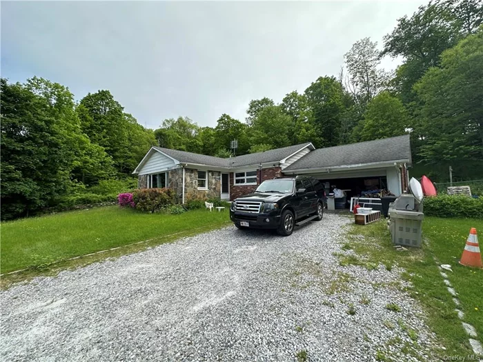 Amazing property in Patterson ny. 3 Bedrooms and 2 baths sitting on just more than 4 Acres. Two real wood burning fireplaces with a built in bar. Finished Basement.
