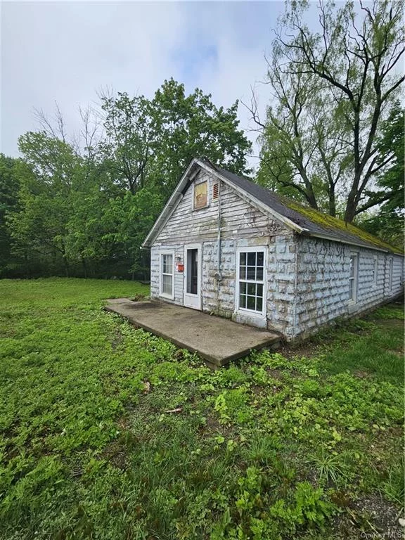 This land being offered is waiting for your attention! The town building department is asking for engineering documents concerning the septic to bring this property back to life for possible commercial space. Enjoy the small stream and the pleasant piece of land with trees and lawn which is just the right size for lower maintenance and taxes. Due to condition of the building this is not a mortgageable property. Building may have to be demolished and town might only allow commercial applications. This a CASH DEAL only. It is not possible to enter the building in it&rsquo;s present condition. Stones throw to major roads and highways.