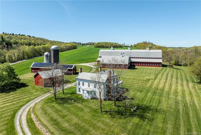 This pristine farm property consists of 55+ acres of prime land with a gorgeous colonial home, picturesque early barns, a silo with stairs to a lookout platform and a spectacular 30, 000 sq. ft. barn. This is country living at its finest in a most scenic area of the Hudson Valley. A spectacular offering where the house affords outstanding views of beautiful rolling farmland. Its features include a comfortable floor plan with a wonderful country kitchen that opens to a large dining area with fireplace and a door to a covered porch overlooking the sweeping meadow. The dining area flows into the center hall, spacious living room with a fireplace, an office with a fireplace, a full bathroom and mudroom, which complete the first floor. On the second floor, there is a primary bedroom with a private bath, three additional bedrooms, and a full bath with laundry off the hallway. The home has wonderful natural light and stunning views from every room. The fabulous outdoor space includes two covered porches and a beautiful lawn, woodlands and a stream.  The large barn is currently being used as a hay barn, however it was designed to be converted to an equestrian facility. Additional land available. Only a short drive to Route 22 and the Village of Millerton makes it a very convenient location. Enjoy shopping or fine dining in the charming village, a movie or a bike ride on the Harlem Valley Rail Trail. Easy access to Metro-North train service. Discover a peaceful lifestyle on Silver Mountain Road!