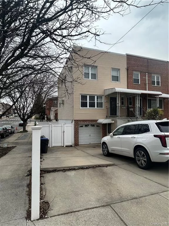 Semi detached brick home in Country Club....6 rooms 3 bedrooms....beautifully done floors...updated kitchen and baths....3 bedrooms...1 1/2 baths...completely finished basement with summer kitchen and full bath....deck, parking, yard....not to be missed...