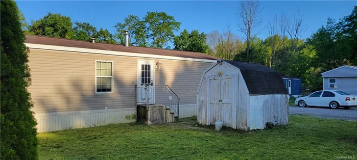 This is a single-wide, 2-bedroom, 1.5-bath manufactured home located on two lots, a short walk from Haviland Middle School. It is sold as-is.