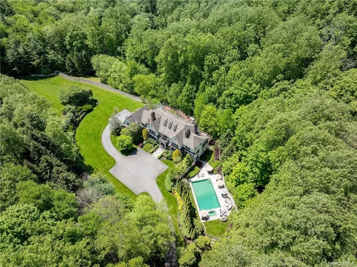 Incomparable stone & shingle manor is the quintessential sanctuary located in Armonk&rsquo;s coveted estate area. Sited at the end of an idyllic cul-de-sac, the 5.21 acre property has been lushly landscaped for ultimate privacy. Grand, yet welcoming, there are 5 bedrooms, 6 full & 2 half-baths, 5 fireplaces, pool & spa, mahogany decks, & level lawns. Built in 2004 & scrupulously maintained, no detail was spared starting with the stunning stone exterior, double-height entrance hall & herringbone wood floor. The chef&rsquo;s kitchen features Viking and Bosch appliances & a butler&rsquo;s pantry. The great room offers built-in cabinetry & a fireplace. A 1st floor bonus is a screened porch, overlooking pool, conceived as a breezy hub in summer & apres-ski lodge in winter. The 2nd floor boasts Primary suite and 4 more bedrooms. Lower level includes a bar, gym, workshop & great room. Steps to hiking trails & minutes to shops & restaurants as well as 684, Rt 22 & Metro-North to NYC. Additional land available.