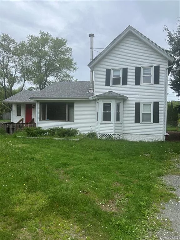 This is a spacious home, zoned residential / commercial, could be a work/live property, or just for a large family. Huge kitchen with a wood burning stove and sliders going out to a nice deck for dining and relaxation. A nice master bedroom on the main floor with 4 additional bedrooms on the second floor. The home has 3 full baths. A great old barn on the back of the property is great for all your storage.  Owner financing available!