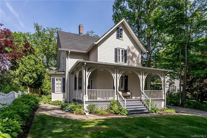 Located in the historic Rhinebeck Village, this home is beloved for its perfect blend of convenience to a charming village and the peacefulness and ease of country life. This lovingly maintained c1797-1850 Carpenter Gothic-style home, with its charming gingerbread trim, is just one block from the vibrant village center, and near the town farmers&rsquo; market, shops, restaurants, Upstate Films, Crystal Lake, schools and community events. It is well set back from the street and sited on a large residential lot, serenely nestled in its picturesque gardens. Inside the large-scale rooms are high ceilings, alcove windows, pocket doors, beautifully preserved architectural details and pristine wide-board floors bathed in sunshine. The heart of the home is the gracious first level with a spacious foyer, dining room, living room, and family room with its own door to the outside and half bathroom. The L-shaped kitchen with Fisher & Paykel and Bosch appliances is a cook&rsquo;s delight with plenty of counter space, concealed laundry and a glass door that opens to the partially covered back porch, where you can enjoy your coffee and paper in Rhinebeck&rsquo;s exquisite morning sunlight, and return for conversations with friends in afternoon shade. A few steps down will lead you to lush perennial gardens, fruit trees, lilac bushes and a pea-stone patio. It is a wonderful space to host parties, and a peaceful place to curl up, listen to the birds sing or read a book. There is a large parking area to provide plenty of off street parking for owners and guests, space for a swimming pool, and with village approval, the possibility of additional development. The home&rsquo;s second level, reached by front or back stairways, has a landing currently used as a home office, a private primary bedroom area with a bathroom, and dressing room or second office. There are two guest bedrooms and another full bathroom. Under the carpet are 8-inch wide pine floors. The home&rsquo;s third level offers an additional 480 square feet of space suitable for finishing. The seller has an extensive list of improvements to share that details how they have diligently maintained and upgraded major systems over the last 14 years: the roof with a lifetime guarantee is 8 years old, a heating system/boiler new in 2019, and new septic in 2021. As well as being close to everything the Hudson Valley has to offer this home, which provides quiet, space and privacy inside and outside, is 5 min from Amtrak in Rhinecliff, 20 min to Kingston, 25 min to Metro North in Poughkeepsie, and 1 hour 45 min to the GWB.