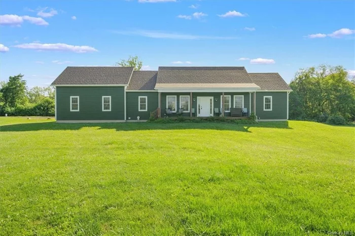 Discover a world of luxury and comfort in this stunning ranch-style gem, crafted in 2020 and nestled on nearly 2 acres of serene, lush land in the picturesque Dutchess Equestrian Farms. As you arrive, the charming rocking chair porch invites you to step inside and experience the unparalleled elegance within. Once through the door, you&rsquo;ll be greeted by a sunlit interior that radiates warmth and cheer, instantly making you feel at home. Perfect for both relaxation and entertaining, the sun-drenched open concept ensures a seamless flow between spaces, enhanced by sophisticated hardwood floors that add timeless elegance to every room. The main living area features a breathtaking floor-to-ceiling fireplace, promising cozy, captivating moments. The chef&rsquo;s dream kitchen, equipped with top-of-the-line stainless steel appliances and a central island, makes meal preparation and entertaining a breeze. Imagine cooking gourmet meals while chatting with guests or enjoying family time around the island. Everyday tasks become effortless and enjoyable in the spacious laundry room with tiled floors. The luxurious primary suite is a private retreat with an ensuite bath featuring luxurious tiled floors and shower walls, offering a spa-like experience right at home. With two additional inviting bedrooms and an extra 1.5 baths, this home ensures comfort and style for everyone in the family. Picture yourself enjoying peaceful mornings on the porch, cozy evenings by the fireplace, and countless joyful moments in this exquisite home. This property perfectly blends modern amenities with classic comfort, creating a serene haven for you and your loved ones. Don&rsquo;t miss this extraordinary opportunity to make this marvelous property your own. Imagine the joy and cherished memories you&rsquo;ll create here. Explore the endless possibilities and embrace the tranquility and beauty that await you in Marbletown. Schedule your showing today and step into the lifestyle you&rsquo;ve been dreaming about.