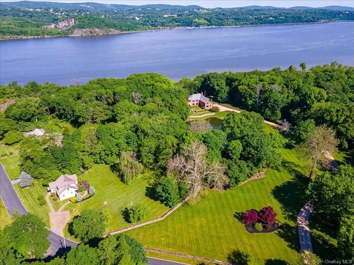 This impressive estate features an assemblage of 3 distinctive homes on contiguous parcels, each meticulously renovated to offer both modern amenities and luxurious enhancements throughout. Set on over 7 acres of spectacular Hudson River property, Featuring a total of 12 bedrooms, 10 full baths, and 3 hath baths spread across the 3 homes, this unique collective offers the opportunity to own a compound laden with on and off site amenities. The Main home is designed in the style of a traditional English country estate with its sprawling floor plan allowing each interior space to transition seamlessly with its exterior areas, blending the over 4000 square feet of blue stone patio with the homes interior all Showcasing it&rsquo;s iconic Hudson River Valley vistas. Completely renovated to create the feeling of old-world elegance and a multitude of modern enhancements, such as gourmet kitchen, recreational room, with wine nook and en suite baths for each bedroom. Crafted with fine materials like old Williamsburg brick, tiled roof and custom mill work in each room, hand crafted walnut cabinetry in the kitchen, with burled wood inlays and coffered ceilings, each space offers a curated experience displaying water views throughout. The array of exterior areas boast a courtyard, outdoor dining room, private hot tub and pathways leading to the covered pavilion or the lower pool terrace and pool house complete with outdoor shower and bath.The additional homes feature a beautifully renovated turn of the century brick colonial home with additional detached garage and Large cottage style home offering one level living, both bordering the main property and offering the opportunity to host guest, family, friends or support staff comfortably. Just over 90 minutes from NYC and minutes from New Hamburg train station, and only 7 minutes from Dutchess County Regional airport this is an amenity rich location affording you the luxury of enjoying all the Hudson valley has to offer.