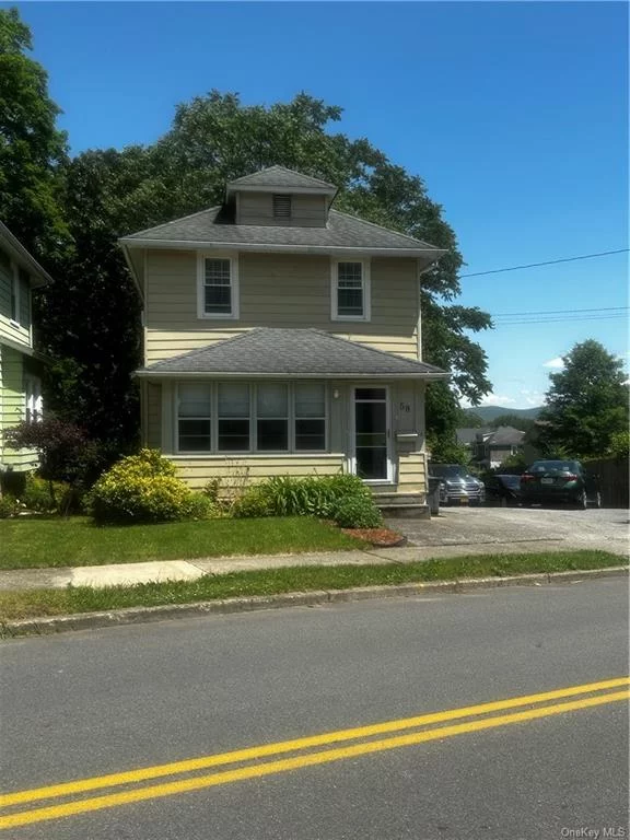 Welcome home to 58 Fowler Ave., in the historic City of Newburgh. This immaculate property is almost too good to be true, with its tree lined back yard and mountain views. The home may have been updated a few years ago but everything still shines like brand new- cherry cabinets, hardwood floors, tile in bathroom, sliding glass doors in the dining area opening to an elevated deck for easy grilling, plenty of storage and closet space for a 100 yr old home,  tastefully landscaped,  20x20 detached garage with an oversized driveway that could easily accommodate an additional 3 cars, but my favorite feature is the enclosed sunroom.