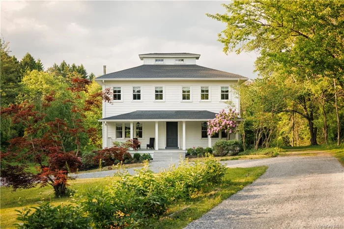 A sprawling farmhouse set on ten acres with a pond and heated saltwater pool, perfectly situated in the Hudson Valley between Rhinebeck and Hudson. Set back from the road down a long, circular driveway, the home is framed by willow trees and blooming perennials, and the whimsical covered porch is reminiscent of iconic Southern architecture. Enter through a mudroom into a wide, gracious foyer where the original tin ceiling is still perfectly intact and painted a luminous glossy blue that sends natural light dancing about the space. A classic four-square configuration, you&rsquo;ll find four rooms off of the central hall. The kitchen sits in the northeastern section of the south-facing home, it is designer renovated perfection with custom, inset cabinetry and a plate rack hung above the farmhouse sink that looks to be plucked right out of a Cotswolds cottage. You&rsquo;ll find a Wolf range, loads of storage, integrated appliances and a large center island. The kitchen leads into the dining room where a Brooklyn artist has handprinted a mural to cover the walls and painted the ceiling a bright and unexpected pop of green. Across the central hall lies a light filled, large living room with build in cabinetry and a woodburning stove. This area leads into the study, painted a moody blue which contrasts beautifully with the bright home. Upstairs, four well-sized bedrooms. The primary suite features exposed beams on the ceiling and a wonderfully sizable walk-in closet. The ensuite primary bathroom has a soaking tub, a separate shower lined in handmade tiles, and jack-and-jill sinks. Two additional bedrooms share a full bath off of the hallway, and another ensuite bedroom lies at the back of the house next to the laundry room. The magic is in the details here, with hardware from Waterworks, unlaquered brass light switches from Forbes and Lomax, and vintage lighting sourced primarily from Italy. Brand new mechanicals. Outside, a sundrenched backyard is the perfect backdrop for the heated, gunite, saltwater pool overlooking a beautiful pond. The ten acre parcel is private and wonderfully dynamic with lawn, woods and water. 2h to NYC and 15m to Amtrak and in the Red Hook school district, this house is pure Hudson Valley charm.