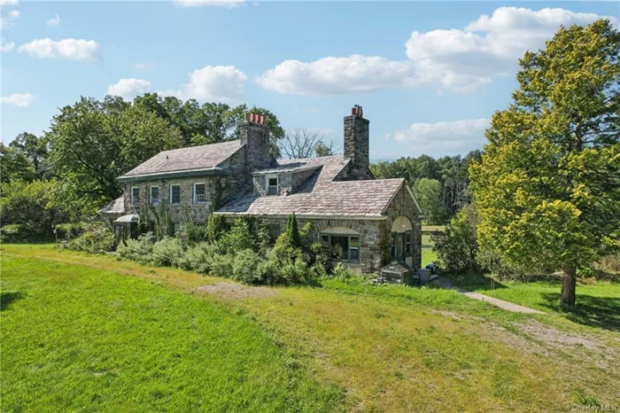 Nestled on the serene shores of Shadow Lake, this grand 6500 sq ft stone residence offers a rare opportunity for those with a vision. Ready to be transformed, this home boasts timeless architectural elements, including three fireplaces with elegant carved details and original bullet hinges on the doors, adding a touch of historic charm. The property is framed by a high stone wall with two wrought iron gate entrances, offering both privacy and a stately presence. A spacious 4-car tandem garage with caretaker&rsquo;s quarters complements the main home, providing ample space and potential for various uses. Designed and built by the visionary Mrs. Georgia Reed, this home carries a legacy of innovation and architectural prowess, deeply rooted in New York City&rsquo;s history. Mrs. Reed, the daughter of the esteemed engineer John B. McDonald who famously oversaw the construction of the first subway line in Manhattan infused her father&rsquo;s spirit of groundbreaking achievement into every corner of this estate.The expansive grounds are ideal for outdoor entertaining or simply enjoying the tranquil lake views. With lake rights included, you can indulge in waterfront living just an hour away from Manhattan. This is a rare opportunity to create a bespoke residence in a truly stunning location.