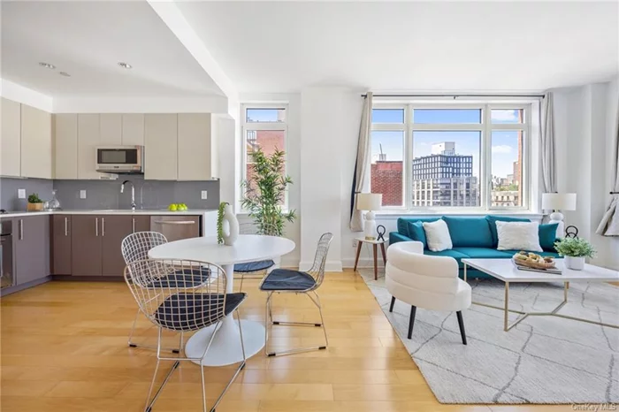 $40, 000 price cut - Motivated Seller !  Rarely available corner unit with double exposure located in the heart of Harlem and a stones throw from each 125th st Subway stop (125th st ACBD and 125th st 2/3). This is a spacious 1 bedroom apartment featuring hardwood floors throughout, a modern kitchen with custom cabinets, Caesarstone countertops, stainless steel appliances and a spacious bathroom featuring double sinks, marble tile and a deep soaking tub. The condo features in-unit washer/dryer. The bedroom easily fits a queen sized bed, has a large closet for clothing + storage and oversized windows that allow incredible sunlight. The unit has windows that block out almost all noise from the street which allows for a peaceful oasis in the heart of Harlem. The building itself is amenity packed with a Doorman on staff from 8:00am  12:00am, an elevator, well equipped fitness center, double roof decks with views of Midtown Manhattan, and a full time super.