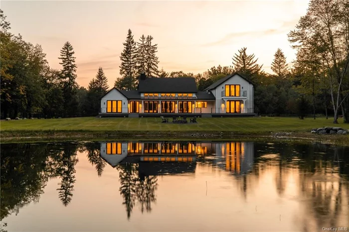 Enjoy exquisite country living at its finest. Welcome to 462 Mettacahonts Road, a newly constructed 4600 SF home in desirable Kerhonkson NY, and just 90 minutes from Metro NY! Set on over 13 acres with large pond and stream, you will enter the winding, pine tree-lined driveway and feel an immediate sense of privacy and rejuvenation as you approach this beautiful country escape. Enter through the oversized front door and be greeted by the crisp oak wood flooring and perfect entry to take off your shoes and hang up your coat. Walk into the dramatic living area of the home - high ceilings and natural light flood the room through the Anderson windows and large doors where you can view the huge deck, firepit, pond, and trails. Move into the custom built, gourmet kitchen with an oversized island perfect for gatherings and featuring state-of-the-art appliances including a 48-inch Wolf stove, Subzero refrigerator, Whirlpool wine refrigerator and Bosh dishwasher. The beautiful Calcutta marble counters and Italian Aster Cucine cabinetry ties the whole kitchen together, making it the perfect entertainment space for the home. Don&rsquo;t miss the additional sitting area in the kitchen overlooking the front yard, perfect for enjoying a cup of coffee while working from home or planning a delicious meal. Vaulted ceilings, glorious light, ample room for a large dining table, and propane fireplace completes the public space. The primary suite, conveniently located on the first floor, enjoys an expansive, private bathroom beautifully outfitted with gorgeous tile and fixtures, large soaking tub, walk in shower, radiant heat, oversized closet with built in cabinets and direct access to the outdoor deck. The main floor plan has been thoughtfully crafted to include a generous library/office with its own private bath, oversized laundry room, mechanical room and tons of storage. The second floor features an additional primary bedroom with a view of the pond, a balcony that provides access to the back yard, warm toned tile work, large soaking tub and walk in shower. Two more generously sized bedrooms and one additional full bath all replete with exquisite Porcelanos tiles. Spend summers outside with the expansive Trex deck, firepit, walking trails with babbling stream, and pond with a depth of up to 13ft. Located in the heart of the Hudson Valley, you are minutes to world class hiking and climbing at Mohonk Preserve and Minnewaska State Park, less than one hour from skiing, and under 30 minutes to the hot spots of Kingston and Woodstock. Close by you can enjoy golf, spa and dining at Inness Resort, hand crafted beers and spirits at Arrowood and so much more! Come see this jewel and be in for summer!