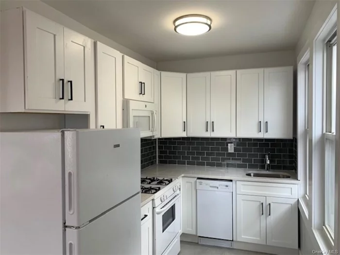 Beautiful, completely renovated one bedroom apartment on a quiet dead end street. Kitchen with quartz counters, hardwood floors throughout, Washer/Dryer in unit. Second floor walk up, close to all, shops, restaurants, public transportation and major highways. Must See! First month&rsquo;s rent, one month security and One month broker fee due at lease signing.