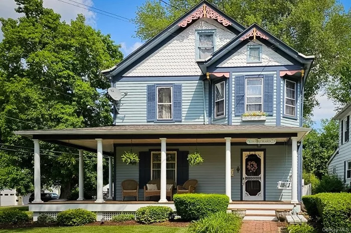 LIVE IN THE WALLKILL HAMLET! Welcome HOME to this beautiful 4 bedroom, 2 bath Victorian treasure nestled in the heart the Hamlet of Wallkill and in the Wallkill Central School District. Built over a century ago, this historic gem boasts timeless details like pocket doors, a lovely stained glass window, a tin ceiling, built-in bookshelves and crystal and enamel doorknobs. The spacious wrap-around porch invites you to relax, enjoy this quaint neighborhood- AND have a front row seat to the famous Wallkill St. Patrick&rsquo;s Day parade. The meticulously manicured and landscaped backyard is a true oasis, offering a private retreat with patios, gardens, and a hot tub perfect for unwinding after a long day. Home also has a fenced-in yard, a 2 car detached garage, stainless steel appliances, a walk-up attic, and laundry hookups in the full basement. Schedule your showing NOW!