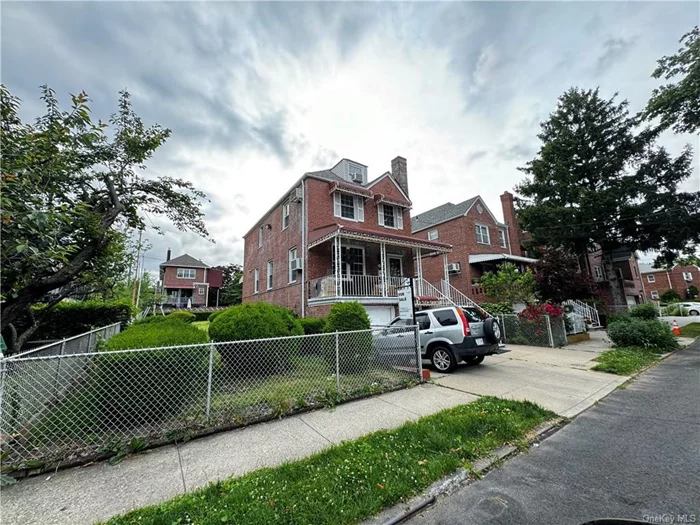 Stunning detached brick house nestled in the vibrant Indian Village Neighborhood of the Bronx. This spacious home boasts 4 bedrooms and 2.5 bathrooms, offering a total of 2690 square feet of living space on a generous lot spanning 5001 square feet. The main level features a formal dining room, living room, powder room, and eat-in kitchen. The second level features 3 spacious bedrooms and full bathroom. The third level is a finished attic that can be used as a guest bedroom, office, or home gym. There is a finished walkout basement with a summer kitchen, guest room, and full bathroom. The attached garage provides secure parking and ample storage space. This home sits on a double lot and is a short distance to Pelham Parkway, Williamsbridge Rd, and Morris Park Avenue. Easily commute to NYC via MTA 5 train or Express Bus. Major highways are easily accessible.