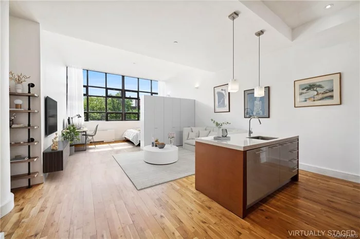 Welcome to One Brooklyn Bridge Park, 360 Furman Street. This east-facing loft studio features 12.5-foot ceilings, a chef&rsquo;s kitchen with Italian Dada cabinetry, a marble island, a Sub-Zero fridge, and a Bosch oven. It includes terrazzo-tiled bathroom, a soaking tub, a shower, solid oak floors, and an in-unit washer/dryer. Residents enjoy access to Brooklyn Bridge Park, offering extensive recreational spaces.  Building amenities include a full-time doorman, staff, conference rooms, a 3, 000 sq. ft. fitness center, Peloton bikes, sports courts, a movie room, music room, game lounges, yoga studio, golf simulator, and landscaped courtyards.  Future plans include transforming nearby Brooklyn-Queens Expressway sections into pedestrian zones. Conveniently located near the 2, 3, 4, 5, A, C, and R subway lines, and B25, B61, B63, and B67 bus routes. The building offers a daily shuttle to subway stations and is close to the NYC Ferry at Brooklyn Bridge Park Pier 6, providing connectivity.