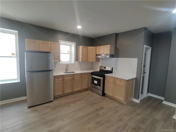 Great Morris Park location this completly renovated two bedroom one bath apartment is located on the second floor walk up new kitchen has stainless steel appliances, hardwood floors throughout , close to public transportation and retail stores, no pets , no smoking.