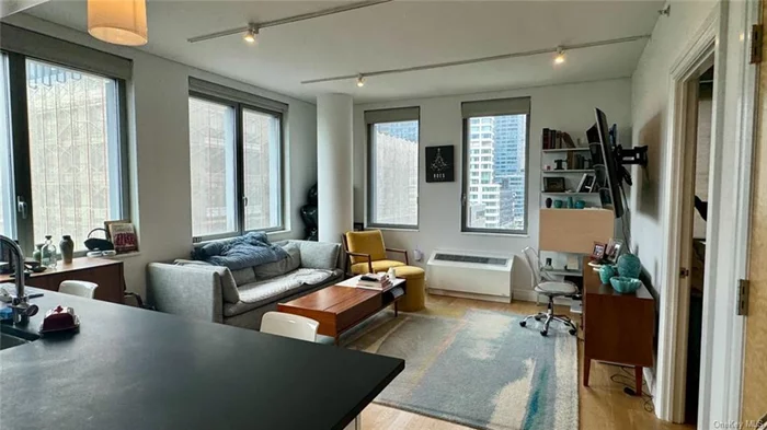 Corner RENT STABILIZED 2 BED 2 BATH. W/D in unit available.Please note this is available from August 5th till February 15th. You can then renew with the building if you like for one more year. The residence is The Mercedes House, a stunning, contemporary glass structure located on 54th Street between 10th and 11th Avenues. This corner apartment offers breathtaking Hudson River views, abundant windows, and plenty of natural light. The building boasts exceptional amenities, including 24-hour doormen, a spacious gym, a swimming pool, outdoor terraces, and a remarkably friendly staff. The apartment itself features in-unit laundry, ample space, and modern finishes. At the end of the current lease term, you will have the opportunity to renew your lease.