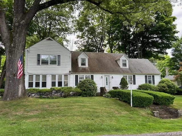 Large Colonial home loaded with Charm- great for an extended family - 4 BR&rsquo;s up and Guest BR or additional Den down. Updated baths, Hardwood floors, fireplace, 2 staircases, large closet areas, enclosed porch, slate patio, oversized level property, walking distance to town and lake. Full basement. This house has great potential - must see.