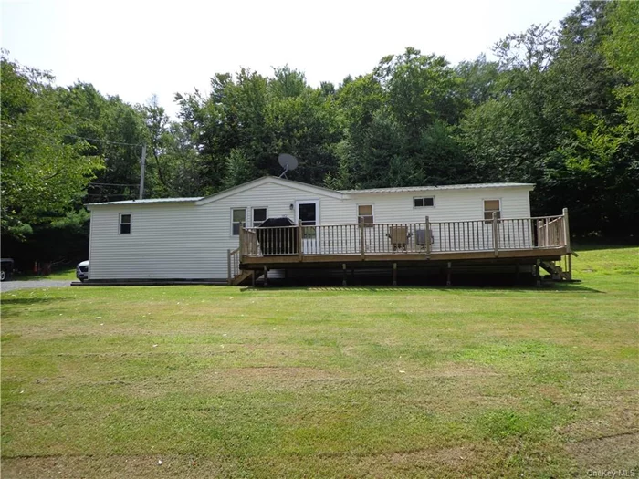 .56 Acres with 2 well-kept mobile homes on it. Located in the Town of Neversink & Tri Valley school district.  Property has private well & septic as well as private driveway with ample road frontage. Property has been used as Rental Income.  The first home is a 2004 singlewide with 3 bedroom & 2 full bathrooms. Kitchen/Livingroom open floor plan.  The second home is a 1988 Doublewide which has 4 bedrooms & 2 1/2 bathrooms. This home has been partial remodeled with new 100% Waterproof Ridged Core flooring, new carpet in Master Bedroom, both full bathrooms remodeled & all new kitchen cabinets, countertops & Samsung appliances. Washer & Dryer hookup and large 10x30 wood deck.  Serious Buyers Only. Will consider reasonable offers. Pre-Approval required. Owners are selling AS IS