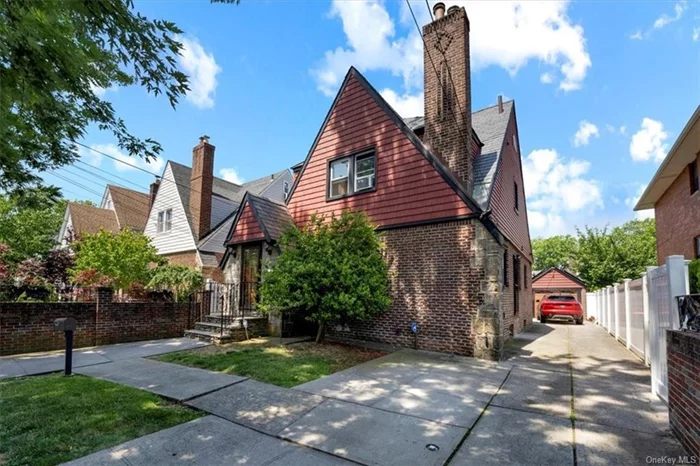 Welcome to this exquisite Tudor-style single-family home located in the highly sought-after neighborhood of Jamaica Estates, Queens. This charming residence seamlessly blends classic architecture with modern amenities, offering a perfect sanctuary for discerning buyers.  Key Features:  Architectural Elegance: This home boasts the timeless appeal of Tudor design, featuring a picturesque fa ade with meticulously maintained brick and stone accents.  Modern Upgrades: Enjoy peace of mind with an array of recent updates including an expensive slate roof, state-of-the-art boiler, updated electrical and plumbing systems, and a new sewer system.  Enhanced Exterior: The home&rsquo;s exterior shines with new siding and windows, ensuring energy efficiency and curb appeal. The updated garage provides ample space for parking and storage.  Eco-Friendly Living: Equipped with solar panels, this home offers sustainable living while reducing energy costs.  Interior Excellence: Inside, you&rsquo;ll find beautifully restored hardwood floors that add warmth and elegance to the spacious living areas. The thoughtfully designed layout provides a perfect balance of formal and casual living spaces.  Gourmet Kitchen: The updated kitchen is a chef&rsquo;s dream, featuring high-end appliances, custom cabinetry, and plenty of counter space for meal preparation.  Comfort and Convenience: Each bedroom offers generous closet space and natural light. The bathrooms have been tastefully renovated with modern fixtures and finishes.  Prime Location: Nestled in a tranquil, tree-lined street, this home offers the serenity of suburban living while being just a short distance from vibrant shopping, dining, and entertainment options. Excellent schools and parks are also within easy reach.  Outdoor Retreat: The beautifully landscaped yard provides a private oasis for relaxation and entertaining. Whether hosting a summer BBQ or enjoying a quiet evening under the stars, this space is sure to delight.  Don&rsquo;t miss the opportunity to own this magnificent Tudor home in one of Queens&rsquo; most desirable neighborhoods. Schedule a private showing today and experience the perfect blend of historic charm and modern luxury.