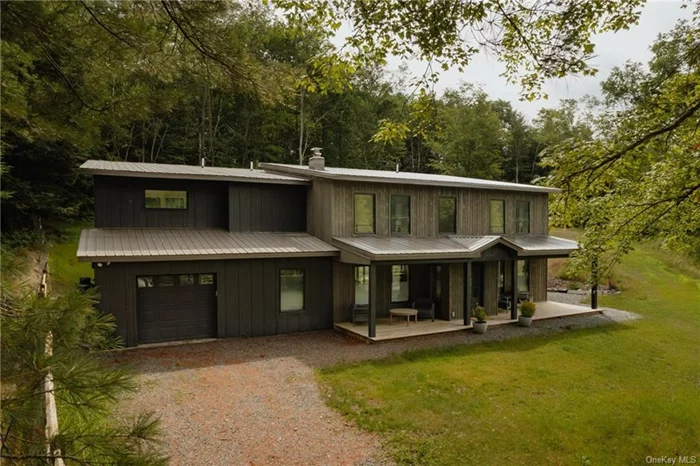 This exquisitely renovated home has been fully reimagined from the ground up preserving only the impressive stone chimney from the original homestead. Design-forward and essentially brand new this lovely property features a Reform kitchen, Riva engineered European Oak floors, mini splits for heating and cooling, and oversized Anderson windows in every room. Each and every space feels light and bright and even the loft space that opens to the balcony, the bonus guest room/office, and the well-appointed laundry room feel thoughtfully considered. Expanding the second level and adding double height ceilings provided a dramatic and modern take on the home&rsquo;s original floor plan. The primary bedroom is a spacious and luxurious retreat, and the spa-like ensuite with radiant floors is absolutely one of the highlights. This home is as functional as it is beautiful with a new septic system, new plumbing & electric, tons of storage both built in and closets and an attached garage. Situated on 1.9 acres, the property has recently undergone an extensive landscaping project that will produce a low maintenance and sustainable grassy lawn/meadow. A quick 3-minute drive from all of the amazing shops, restaurants, and arts/entertainment along Livingston Manor&rsquo;s bustling Main Street, this prime location can&rsquo;t be beat! Only a touch farther to Roscoe, Parksville, and Jeffersonville, this spot is close to a gazillion fun things to see, amazing places to eat and so many great local farms and businesses to enjoy and support! World class fly fishing spots, hiking, swimming and more can be found in one of the many nearby rivers, lakes and wild forests!