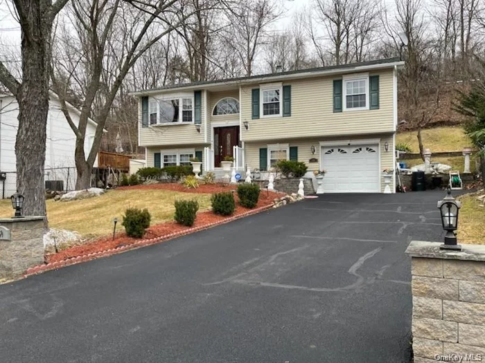 4 possible 5 Bedroom two level - BI-Level home in move in ready mint condition. Newer Kitchen and Baths AND There is a second Kitchen on the lower level with Oven Range, Sink, and Refrigerator. Beautiful wood floors throughout.
