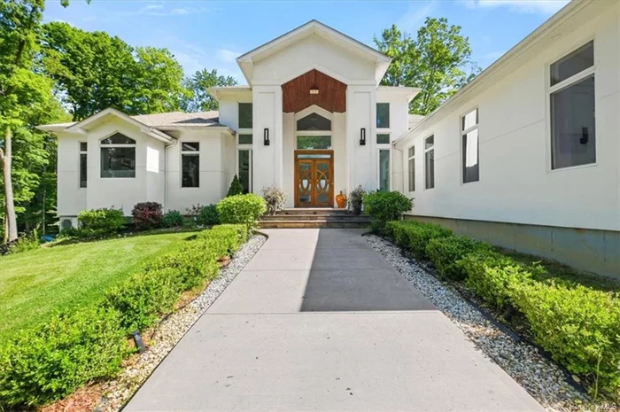 Welcome to this luxurious well crafted contemporary home situated on 2.8 acres in the Shawangunk area featuring over 6, 500 sq. ft. with natural light that abundantly overflows this home. In the main level you will be captivated by the soaring tray ceiling, spacious open-concept floor plans with expansive windows, double sided wood burning fireplace w/french doors leading out to the patio. Entertain in the chef&rsquo;s gourmet kitchen that seamlessly flows into the dining room, living room, or breakfast bar island. The first floor primary suite has soaring tray ceiling, en-suite bath with a separate toilet room, double vanity sinks, deep soaking tub, eco friendly fireplace, enormous walk-in closet, sitting area, and patio doors leading to a private terrace w/ hot tub. The lower level has additional rooms that provide opportunities for creative living space - such as: office, gym, guest room, recreational space or rooms of your choice and with the proper permits there are possibilities for two accessory apartments.  The detached 3 car garage is over 1, 000 sq. ft, equipped with a car lift, wood burning stove and a workshop. Home is wired interior & exterior for the security system and a multi-zone audio music surround sound system with built-in speakers on the main entertaining level. This home runs on an energy efficient system: on demand hot water from combo boiler which is 96% efficient. Radiant Floors with hydro coil air handlers that add supplemental 3 zone heating and 3 zone central a/c on main level; foam insulation throughout & all garages. Electrical panel wired for a generator. This property is surrounded by meadows, flowering trees, and open fields providing a tranquil & serene lifestyle. Minutes to farms wineries, orchards; 18 miles to Mohonk Mountain House, & Minnewaska State Park; 8 miles to Wildflower Farm.  Make this luxurious retreat your home or weekend escape.