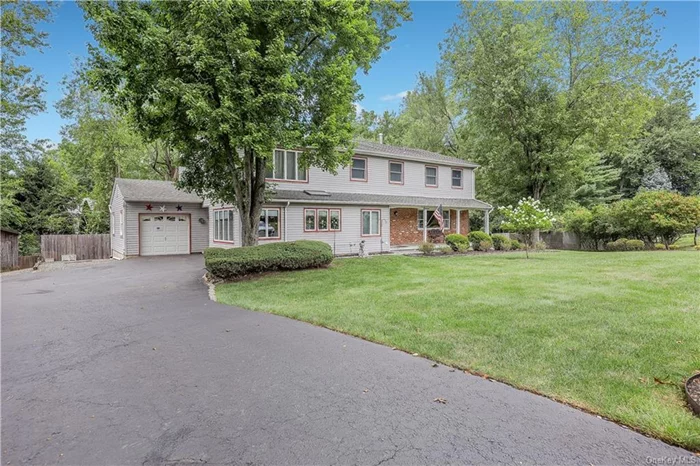 Looking for the perfect home for extended family? Look no further than this beautiful center hall colonial with newly painted interior, situated on this cul-de-sac in the award winning South Orangetown Central School District. Located in the heart of Blauvelt, this home features an Eat-In-Kitchen, foyer, formal living room with custom built bar, formal dining room, 3 oversized bedrooms, a full bath and a tremendous primary suite with walk in closet, vanity area and a full bath. The extension, perfect as an in-law suite, includes a full Eat-In-Kitchen, pantry, laundry area, family room with cozy stoned wall fireplace, 1/2 bath, primary bedroom with full bath and plenty of storage. The outdoor living space is just an added addition to this one of a kind property. A must see!