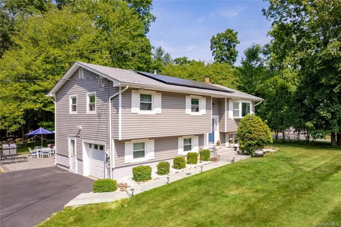 Prepare to be enchanted by this meticulously cared for bi-level home on a quiet cul-de-sac. This residence offers endless updates and spectacular outdoor space. Unwind in the delightful 3-season sunroom overlooking a serene, private backyard bordered by woodlands (adding appr 300sf not shown in the listing). The heart of the home is a trendy kitchen renovated in 2021, featuring quartz countertops, stainless steel appliances, a wine fridge, farmhouse sink, and a new skylight with remote-controlled blinds, enhancing the space with abundant natural light. The lower level provides an inviting retreat with a contemporary fireplace in the family room, a spacious bedroom, and a full bathroom. A brand new laundry/mudroom with convenient access to the driveway adds practicality and ease to daily living. Outside, the park-like backyard invites you with a new expansive paver patio, perfect for entertaining or quiet relaxation amidst nature. Additional features include leased solar panels for significant energy savings, promoting both environmental responsibility and reduced utility costs. Please schedule a confirmed appointment before visiting. Note that the sellers plan to occupy until year-end. Don&rsquo;t miss the opportunity to experience firsthand the warmth and allure of this exceptional home.