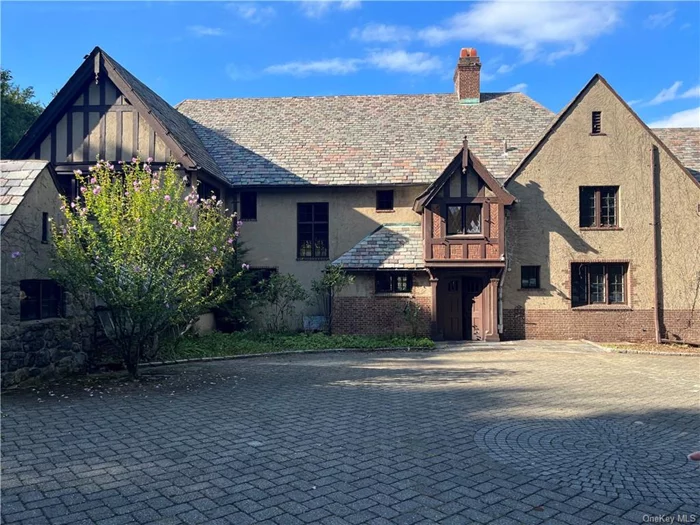 This turn of the century 6 bedroom, 6 bath Tudor has so much to offer. Privacy, serenity, & a huge greenhouse to grow your own garden. Great flow for hosting your parties . Walk to train & shops