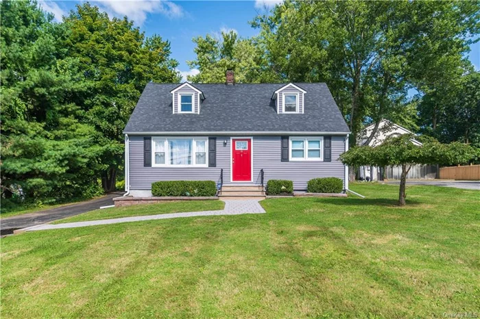 Welcome to this beautifully updated Cape Cod 4 bedroom, 2 bath home in the Village of Monroe, NY. The living room basks in lots of natural light with hardwood floors leading to the renovated eat in kitchen w/ subway tile backsplash & island, sleek SS appliances & ample cabinetry. Adjacent to the kitchen is a spacious sunroom creating a perfect space for relaxation or entertaining. Convenient 1st fl bedroom. Master & two addl bedrooms on 2nd fl. w/cedar-lined closets. The level backyard is perfect for outdoor gatherings, complete with a stamped concrete patio area ideal for grilling and lounging. The basement features a brand new French drain system with sump pump, making it ready to be finished to suit your needs, whether for additional living space, a home gym, or extra storage. Lots of storage available in the eaves and basement. Ideally located close to shopping, schools, parks, and the scenic Heritage Trail, nearby wineries, farms offering fresh produce. A must see. MW Schools.