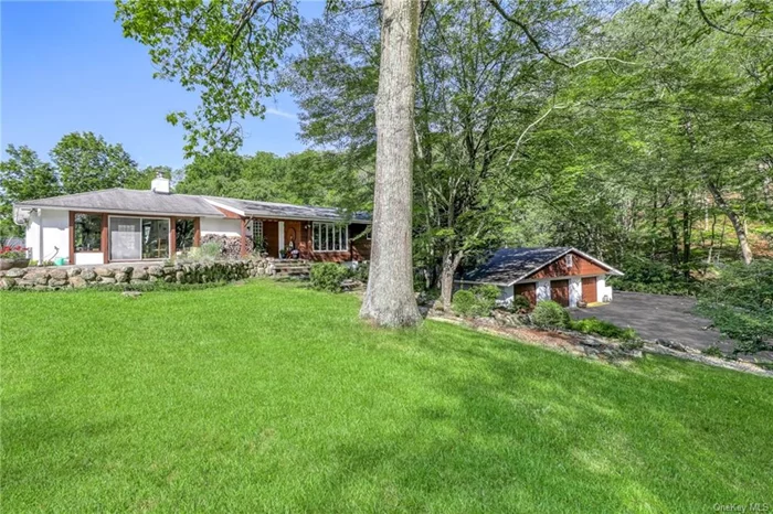 Nestled next to the rolling hills of Harriman St Pk, this private mid-century gem is surrounded in an unparalleled setting of protected lands. This is not just a home, it&rsquo;s a connection to nature. Generous use of wood & glass play to the natural theme. Warm & inviting LR w/walls of glass, stucco FPL, terra cotta tiling & custom-built library. Formal DR w/kit pass-thru. Gourmet kit w/tons of storage and built-in&rsquo;s, butcher block island, skylight, Chambers cook top and subzero frig, bar area. Primary bdrm w/white oak built in cabinetry influenced by Charles Gwathmey (architect involved w/renovation of Guggenheim Museum). Tons of closets, renovated ensuite bth w/shower, tub, and bidet. 2 add bdrms w/Jack n Jill bth. Sauna. Lower level is walk out with 4th bdrm, summer kit, bath, FR w/bar, office and laundry. Perfect for extended family. Gunite Pool w/cabana. 3 bay garage. Despite its secluded feel, it&rsquo;s just min away from train, highways & shopping. Enjoy hiking, canoeing & camping in Pk