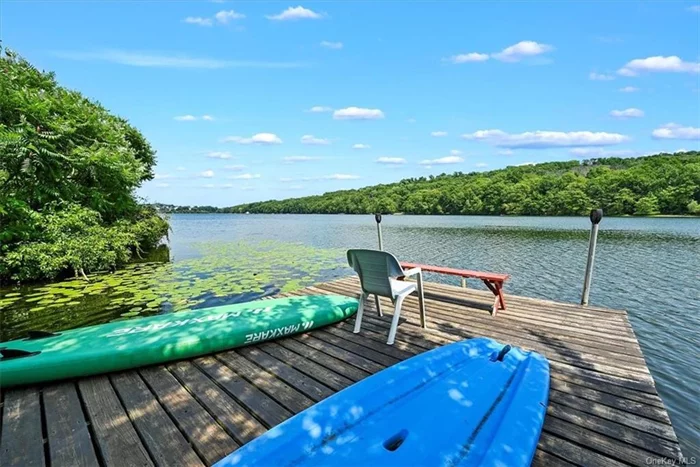 Charming Two-Story Home with Private Dock and Four Seasons of Lake Fun!! Discover the perfect blend of comfort and adventure in this delightful home, nestled in the heart of Monroe with picturesque lake views from just about every room. Offering three bedrooms, two ample living room areas, efficient kitchen with a butcher block island, two full baths, and dining room with a sunlit picture window that embraces the view. Multiple outdoor gathering areas, both covered and uncovered. Want to embrace the serenity? Lounge around on your private dock and take in endless opportunities for year-round fun, this property is your gateway to an idyllic lifestyle. Monroe Woodbury Schools. Close to shopping and major highways.