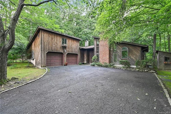 Welcome to paradise. Quiet contemporary tucked away on a lovely cul-de-sac surrounded by thousands of acres of protected state forests yet located close to major highways and shopping. This commuter friendly location is the best of both worlds. One-level ranch layout is perfect for all ages. Natural light pours through the large southern windows in the great room. This grand family and dining room feels expansive with its vaulted ceilings yet cozy with the natural wood burning fireplace that you&rsquo;ll gather around on winter nights. Spacious kitchen is centrally located with plenty of prep space to whip up fabulous meals for family and friends. Master bedroom with ensuite bathroom and walk-in closet will be your sanctuary. Two secondary bedrooms share a main hallway bathroom. Pass through the pantry/mudroom into the two car attached garage. Bonus feature: pull down stairs to a large storage room. Back deck with endless forest views is private and secluded. Large contemporary shed for the hobbyist or garden enthusiast.  As a resident of Woodbury, you have access to the Earl Reservoir, John P. Burke Memorial Pool, Tennis and Basketball Courts, and Brickley Field. Award Winning Monroe-Woodbury School District. Close to major highways, Minutes to commuter train and bus lots. Lots to love here. Welcome home!