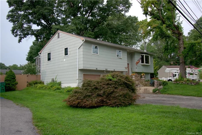 In Spackenkill, just north of the Poughkeepsie Galleria, on a calm road in the quiet Crown Heights neighborhood, there is a four bedroom, two bathroom, approx 1700 sqft Raised Ranch for sale. Situated on a level, third-acre, corner lot with a fenced in backyard. The walkthrough kitchen leads out to the oversized screened-in back porch. Main floor includes living room, dining room, kitchen, full bath, three bedrooms. Lower Level includes a family room / den plus an additional bedroom with a half bath. The furnace room seconds as laundry room. Two car attached garage.  Close to schools, parks, and recreational activities. This commuter location is close to bus, public transportation and Metro North train station. Close to Route 9 Corridor puts you minutes from shopping and dining, yet set back in quiet suburbia. Halfway between Poughkeepsie and Wappingers, the perfect central location to the finer things. Municipal sewer and water provide a few less things to think about. Natural gas heat. Large level front yard.