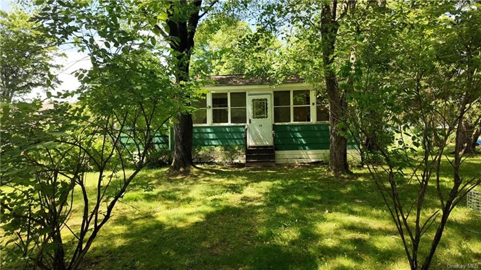 This Charming cottage maintains scenic views, privacy, and an amazing location! Enjoy the wooded lake view from the comfort of the enclosed porch. This home is located on a quiet cul-de-sac with a large level backyard featuring a detached garage. Around the corner from the rail trail and fitness center. Minutes to the Taconic, local colleges, the Walkway over the Hudson, hospitals, shopping, and 1.5 hours from NYC. This property is being sold AS IS.