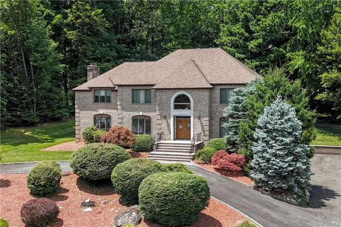 Welcome home to a stunning Center-Hall Manor nestled on the foothills of the Ramapo Mountains. Start or finish your day in your choice of 9 rooms while your culinary feasts are prepared in the gourmet eat-in kitchen. Greet friends in the grand foyer w/ a mixed cocktail & let them find a comfy spot to settle in the flowing floorplan. Conversation, laughter & memories are made in the sunlit great room with space enough for your guests to sit & stay a while. Soak in the summer sun & gentle breezes on the over-sized deck, or toss a football in your lush green backyard. Set up a comfy guest room on the 1st floor for your visitors & then ride your elevator up to your primary suite after your parties & days are done. Designed for luxury, this grand home combines elegance w/comfort & offers exceptional features that are perfect for entertaining & everyday living. The Rio Vista community enhances your lifestyle with amenities such as a pool, tennis courts, a clubhouse, and more.