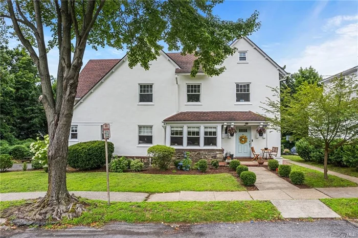 Welcome to this move-in-ready gem, just 0.7 miles from the Bronxville Metro North Station! Recently renovated, this home boasts a stunning eat-in kitchen with stainless steel appliances and quartz countertops, plus a new wet bar with a built-in beverage refrigerator. The Main Bedroom features luxurious heated floors, a separate shower, and a relaxing tub. Upstairs, find three additional bedrooms and a stylishly updated bathroom. The legal third floor offers extra bonus rooms and a full bath, while the walkout basement includes a new full bathroom and ample storage. Enjoy outdoor living on the newly designed deck, perfect for entertaining or dining al fresco. Additional updates include new central air-conditioning, ductwork, a tankless boiler, water heater, and energy-efficient spray foam insulation. This home is truly ready for you to move in and enjoy!