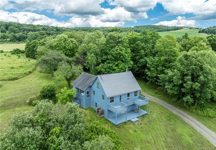 NOW ON THE MARKET UNFURNISHED. Hudson Valley private hillside retreat with south western mountain views. Quiet and special, this is located in the desirable Shekomeko Valley. This contemporary country home is on over 30 bucolic acres. Set well off the beautiful country road, the driveway leads to this renovated haven. Gorgeous vistas of countryside farms and mountains, the landscaping allows for relaxing exploration and exercise through walking paths, pastoral fields and glorious natural vegetation. Exterior wide decking provide additional vantage points for the spectacular surroundings. Entering the house you will see thoughtful stylish design bathed in bright natural light. There are wide-board pine and hardwood maple floors. The Great Room includes vaulted and beamed ceiling living and dining spaces, featuring a wood-burning stove. The galley kitchen is open and cheerful with up to date appliances. Glass door with wooden screen door takes you out to one of the decks from here. All bathrooms are fully renovated with accent lighting. Also on this level is the Primary bedroom which includes a wonderful wall of windows and cathedral beamed ceiling. A loft up top brings an additional bedroom with vaulted ceiling. The lower entry level provides charming screen door, the foyer and additional bedroom with glass slider and another full size bathroom. An exercise room and car garage is also accessed here. Also included is the use of a custom gym nearby with self guided mirror trainer program. Yoga teacher, Personal Chef and Physical Therapy also upon request. Nearby towns of Pine Plains, Millbrook, Rhinebeck, Millerton and Sharon CT. all provide excellent dining and shopping. This is all just two hours from New York. Train service provided by Metro North or Amtrak. Experience the Hudson Valley!